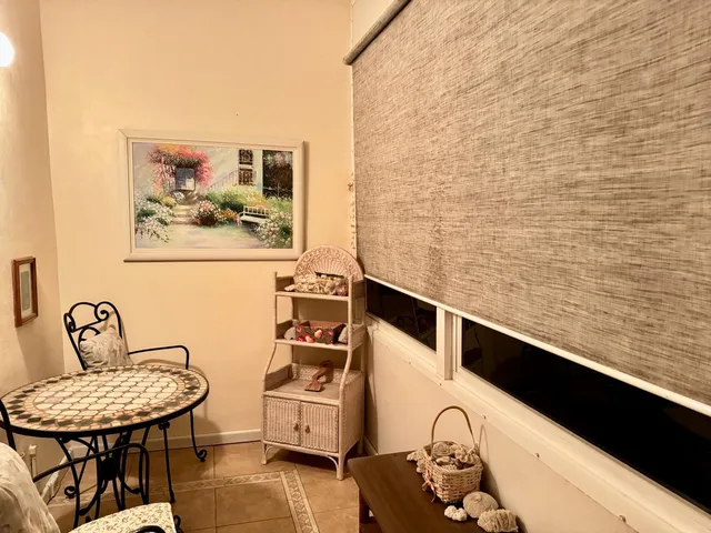 a bathroom with a sink mirror and vanity