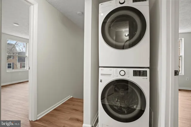 a view of a hallway with washer and dryer