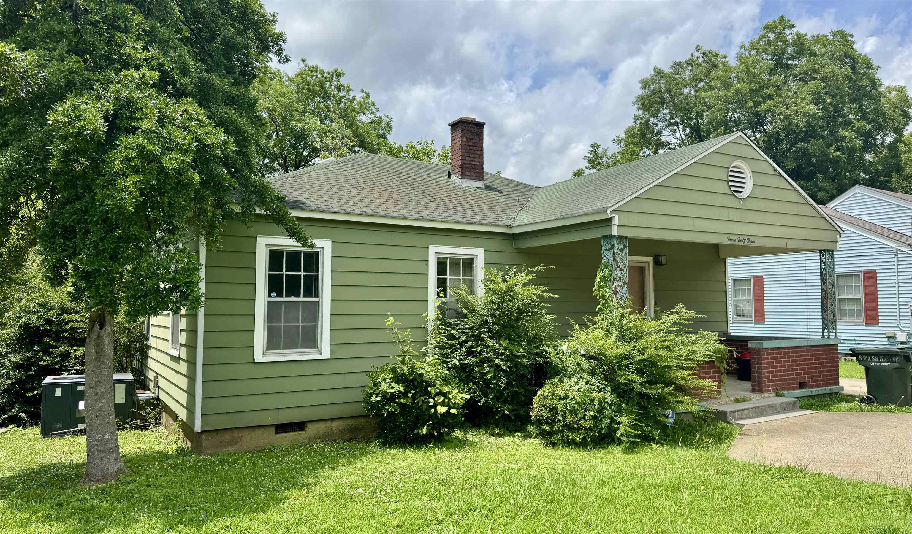 343 Washington Street Ripley, TN 38063 - Photo 1 of 7 a front view of a house with a garden