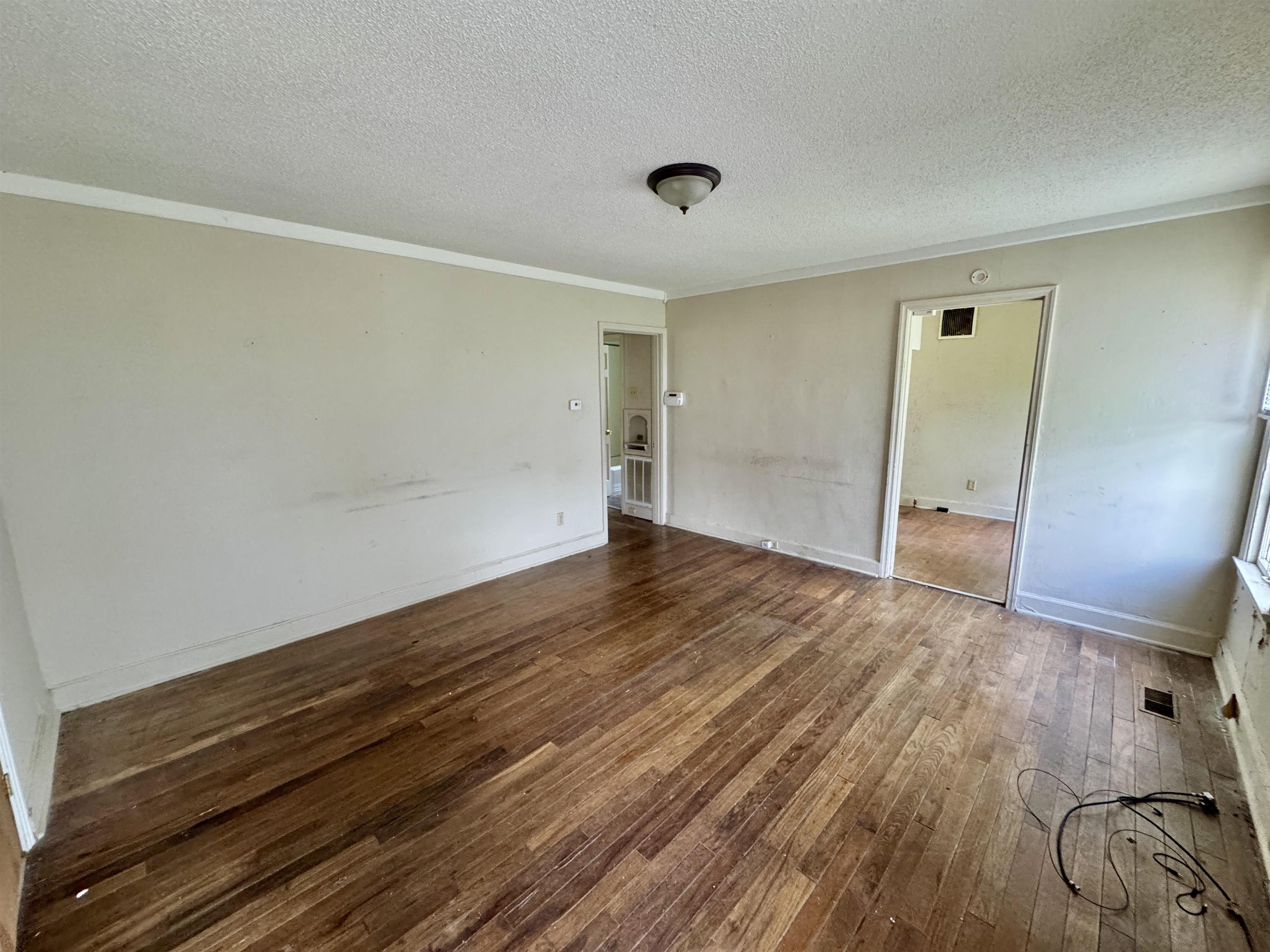 343 Washington Street Ripley, TN 38063 - Photo 4 of 7 wooden floor in an empty room