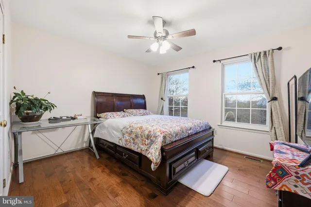 a spacious bedroom with a bed and window