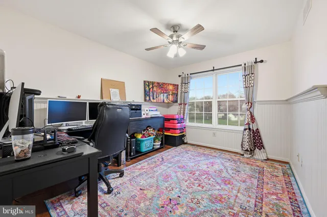 a workspace with furniture and window