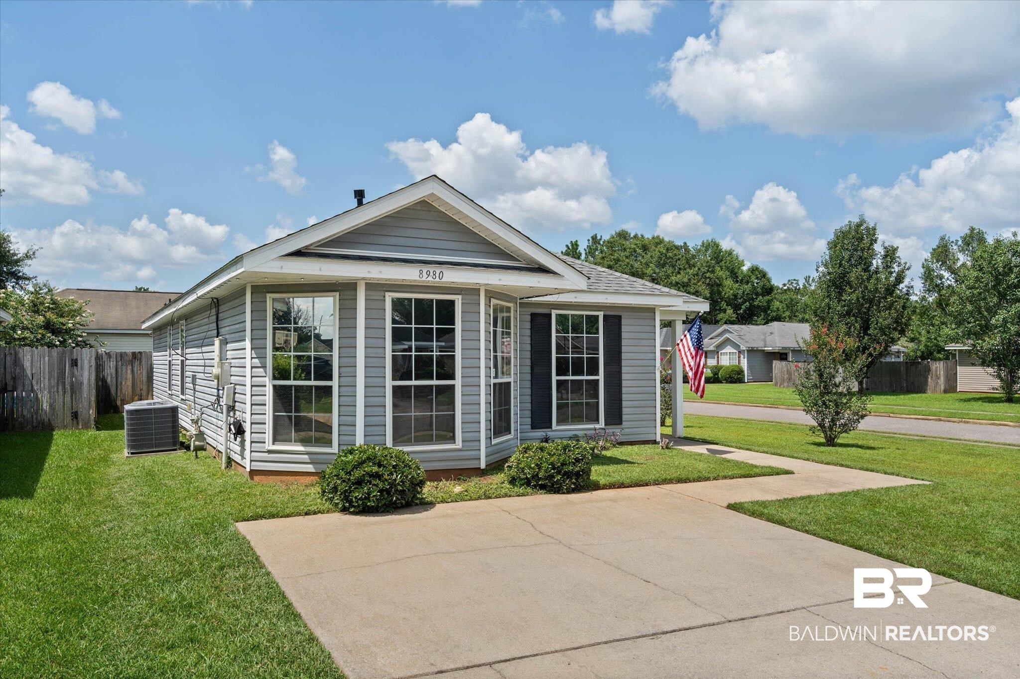 8980 Spring Grove North Mobile, AL 36695 - Photo 22 of 24 Single-story residence featuring gray siding and a light gray roof