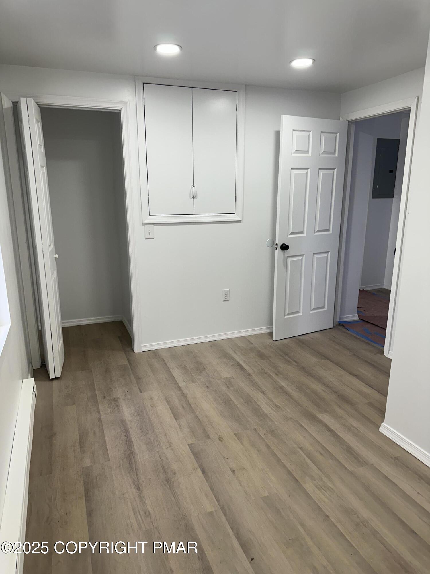105 Glenmere Road Canadensis, PA 18325 - Photo 19 of 28 an empty room with wooden floor and closet