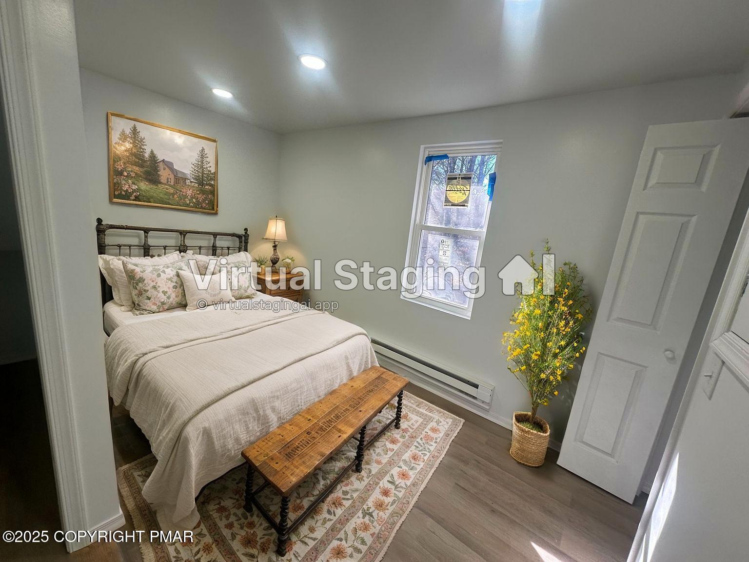 105 Glenmere Road Canadensis, PA 18325 - Photo 20 of 28 a bed sitting in a bedroom next to a window