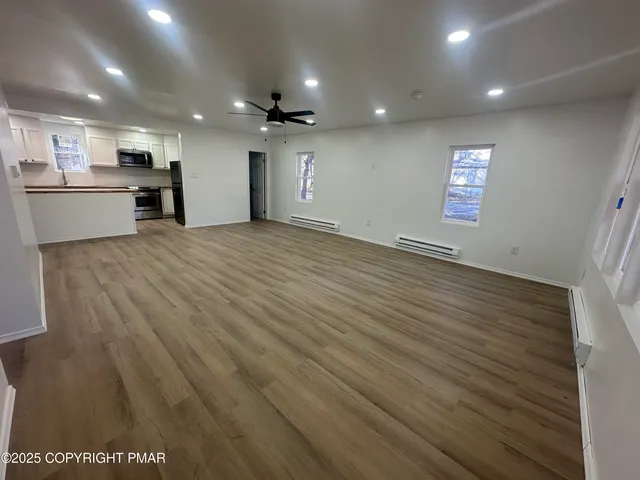 a bathroom with a toilet and a bathtub