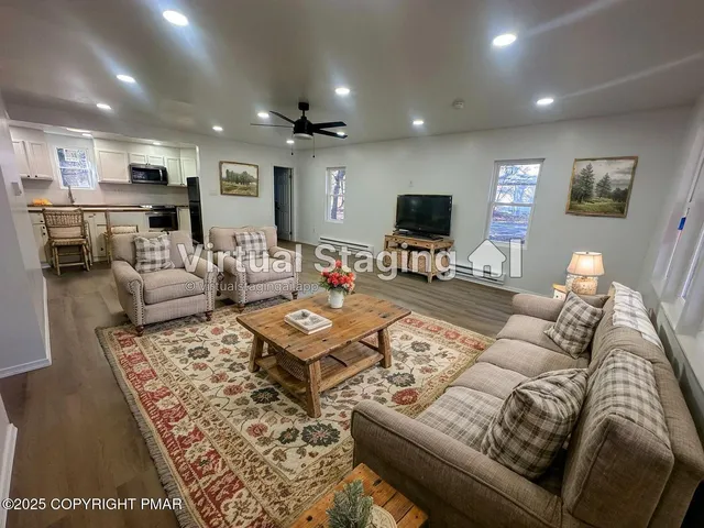 a kitchen with stainless steel appliances granite countertop a sink a stove a microwave and cabinets