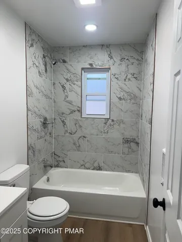 a kitchen with granite countertop a sink stove and cabinets