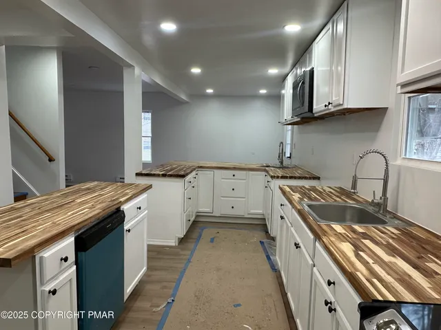 a bedroom with a bed and a large mirror