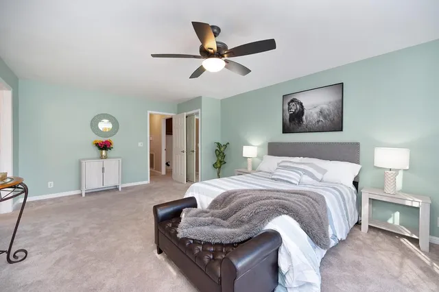 a living room with furniture and flowers