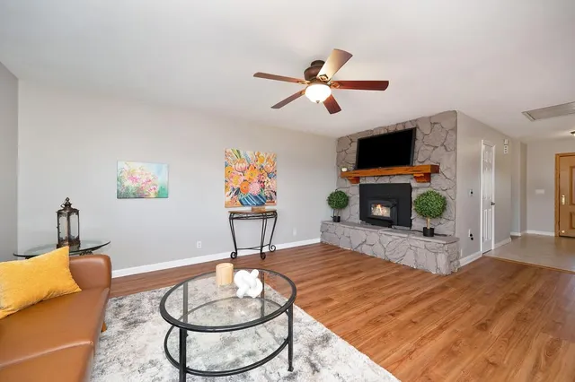 a living room with furniture and a window