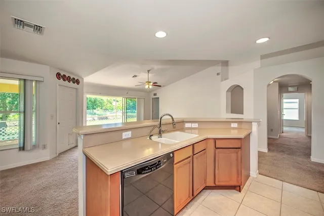 a kitchen with a sink and cabinets