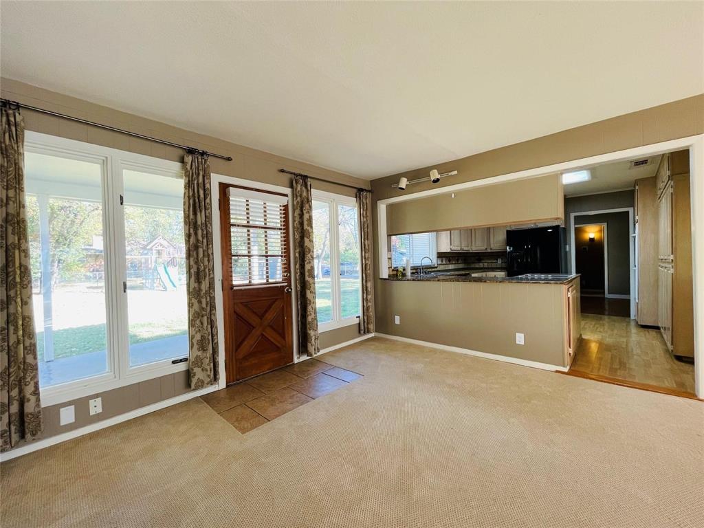 5000 Barbara Road River Oaks, TX 76114 - Photo 4 of 11 an empty room with wooden floor and windows