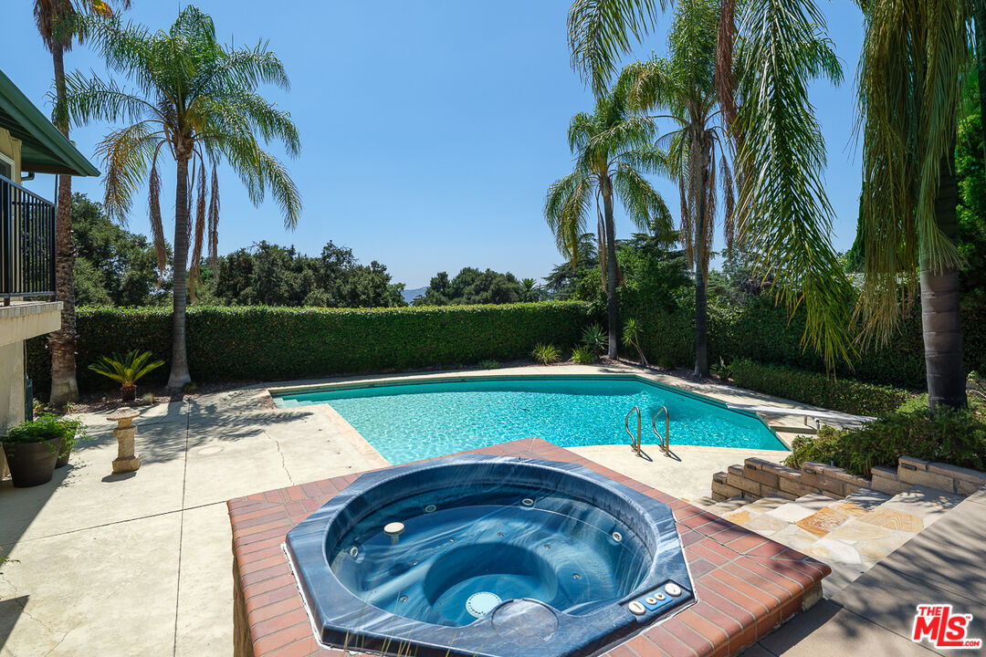 3363 Monterosa Drive Altadena, CA 91001 - Photo 7 of 10 a view of swimming pool with a table and chairs