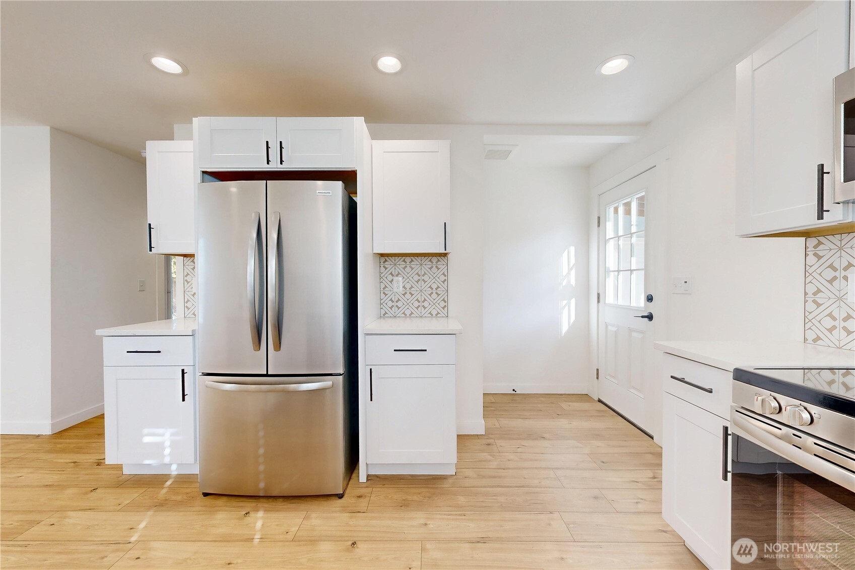 995 Hobson Street Walla Walla, WA 99362 - Photo 11 of 38 a kitchen with stainless steel appliances a refrigerator and a stove top oven