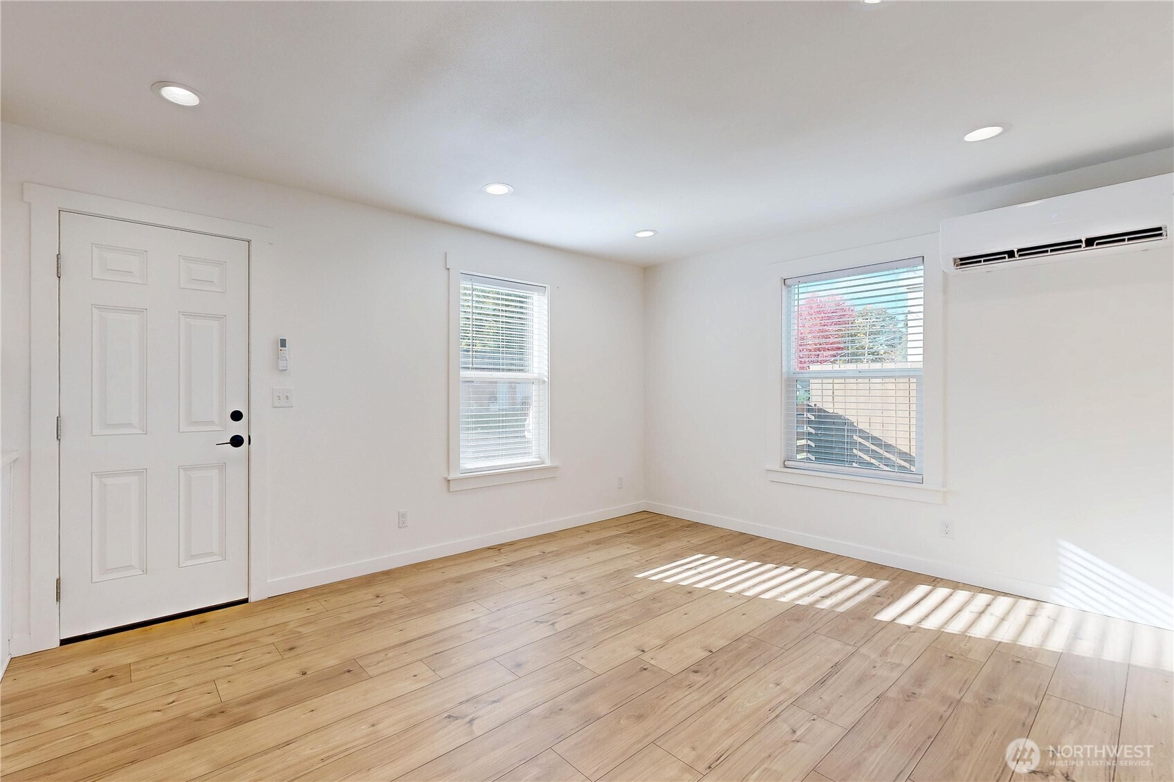 995 Hobson Street Walla Walla, WA 99362 - Photo 2 of 38 a view of an empty room with wooden floor and a window