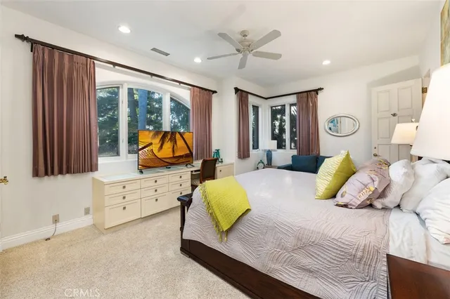 a view of a house with a backyard porch and sitting area