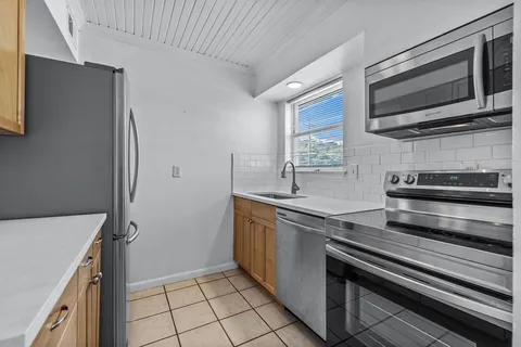 a kitchen with stainless steel appliances a stove and a refrigerator
