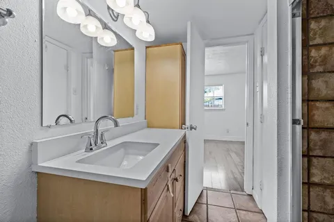 a bathroom with a sink and a mirror