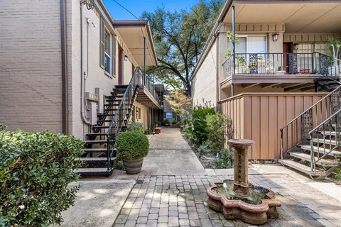 a view of a pathway with a patio