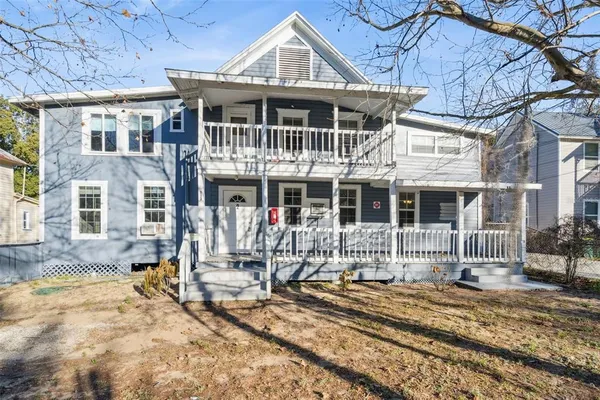 a front view of a house with yard