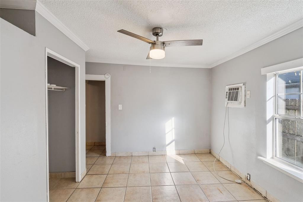 113 South Grove Street, Unit 2 Eustis, FL 32726 - Photo 12 of 15 a view of an empty room with a window