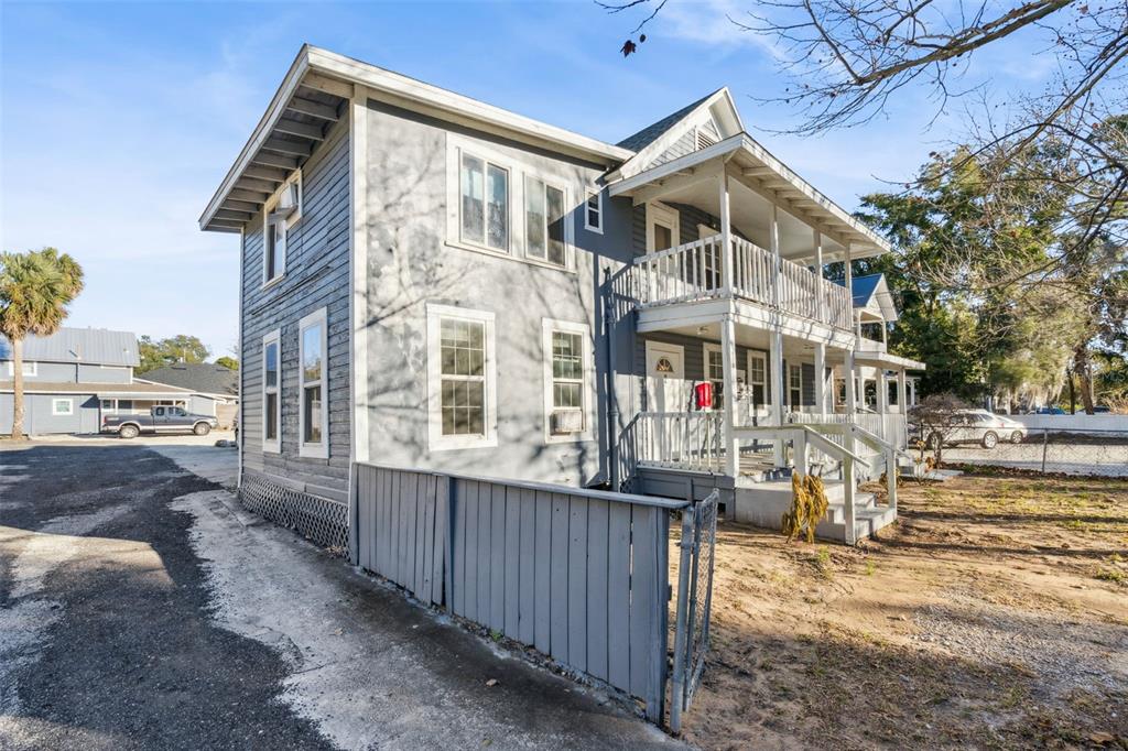113 South Grove Street, Unit 2 Eustis, FL 32726 - Photo 2 of 15 a view of a building with many windows