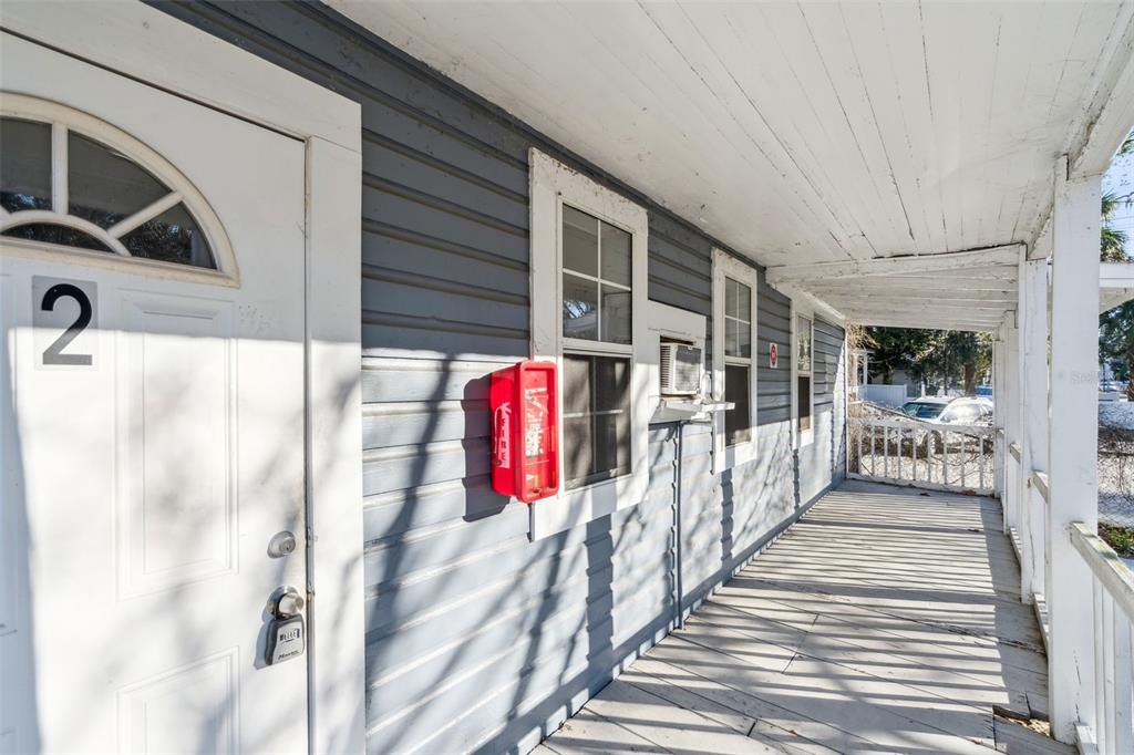 113 South Grove Street, Unit 2 Eustis, FL 32726 - Photo 4 of 15 a view of a porch with a door and a glass door