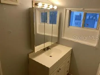 a white toilet sitting next to a shower
