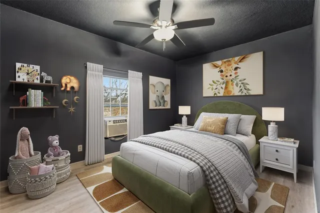 a bedroom with a bed a couch and a window