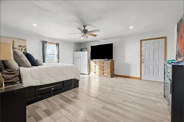 a bed room with a bed and a flat screen tv