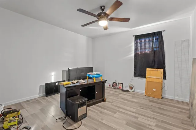 a work room with furniture and wooden floor