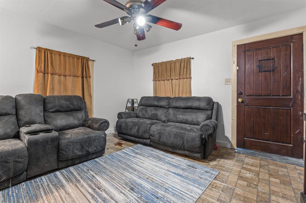 9201 Farmers Road White Settlement, TX 76108 - Photo 6 of 35 a living room with couches and kitchen view with wooden floor