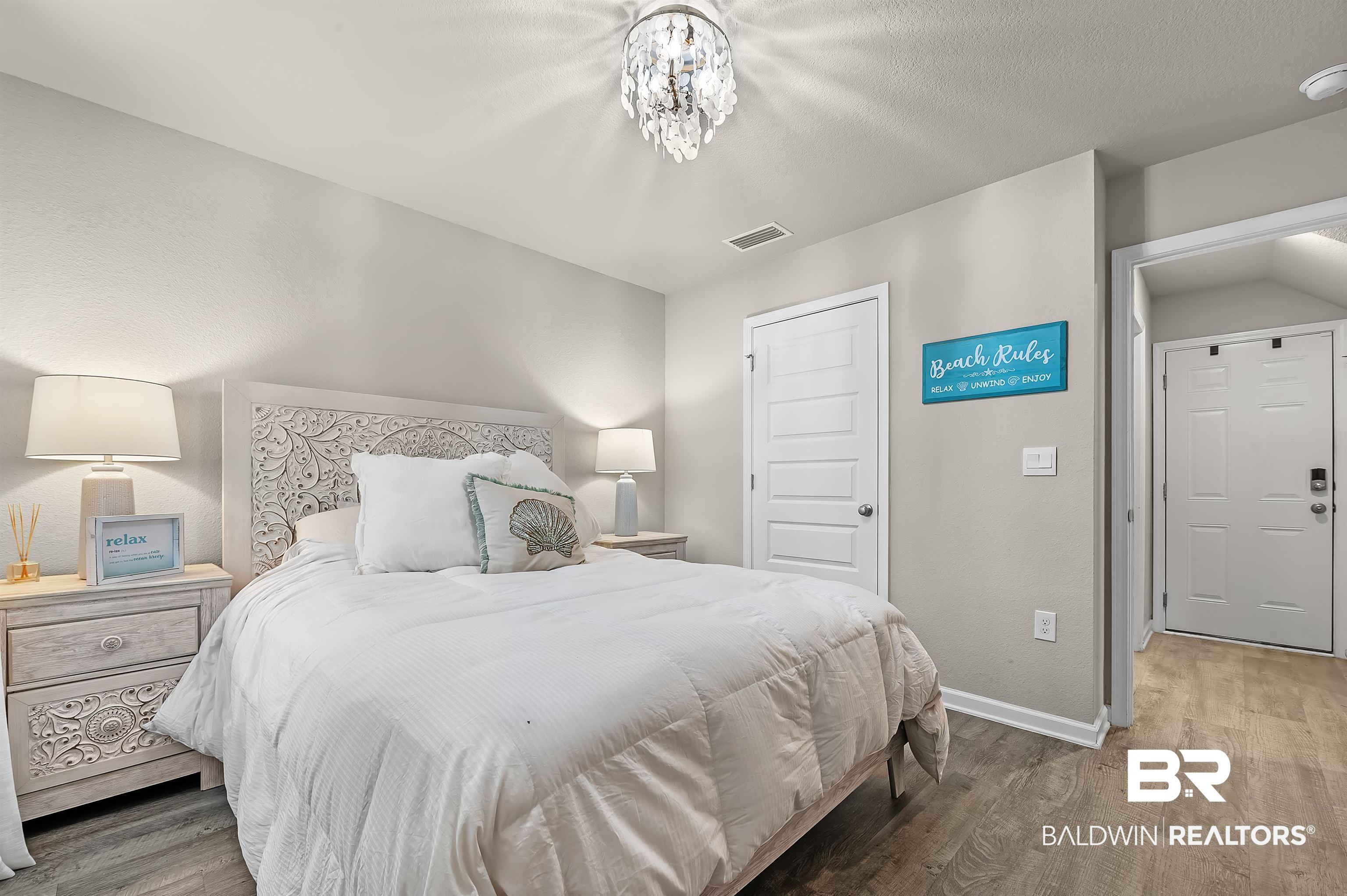 24549 Broken Sound Loop Orange Beach, AL 36561 - Photo 22 of 57 Bedroom featuring hardwood / wood-style floors