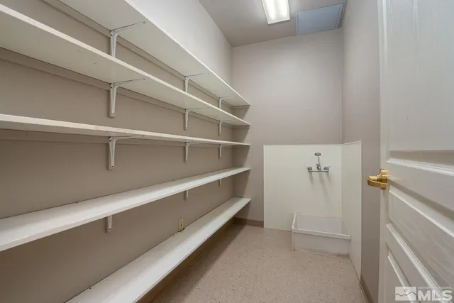a view of an empty walk in closet