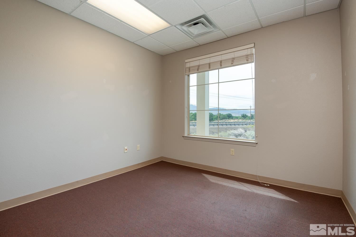 5 Pine Cone Road, Unit 102 Dayton, NV 89403 - Photo 12 of 21 an empty room with a window