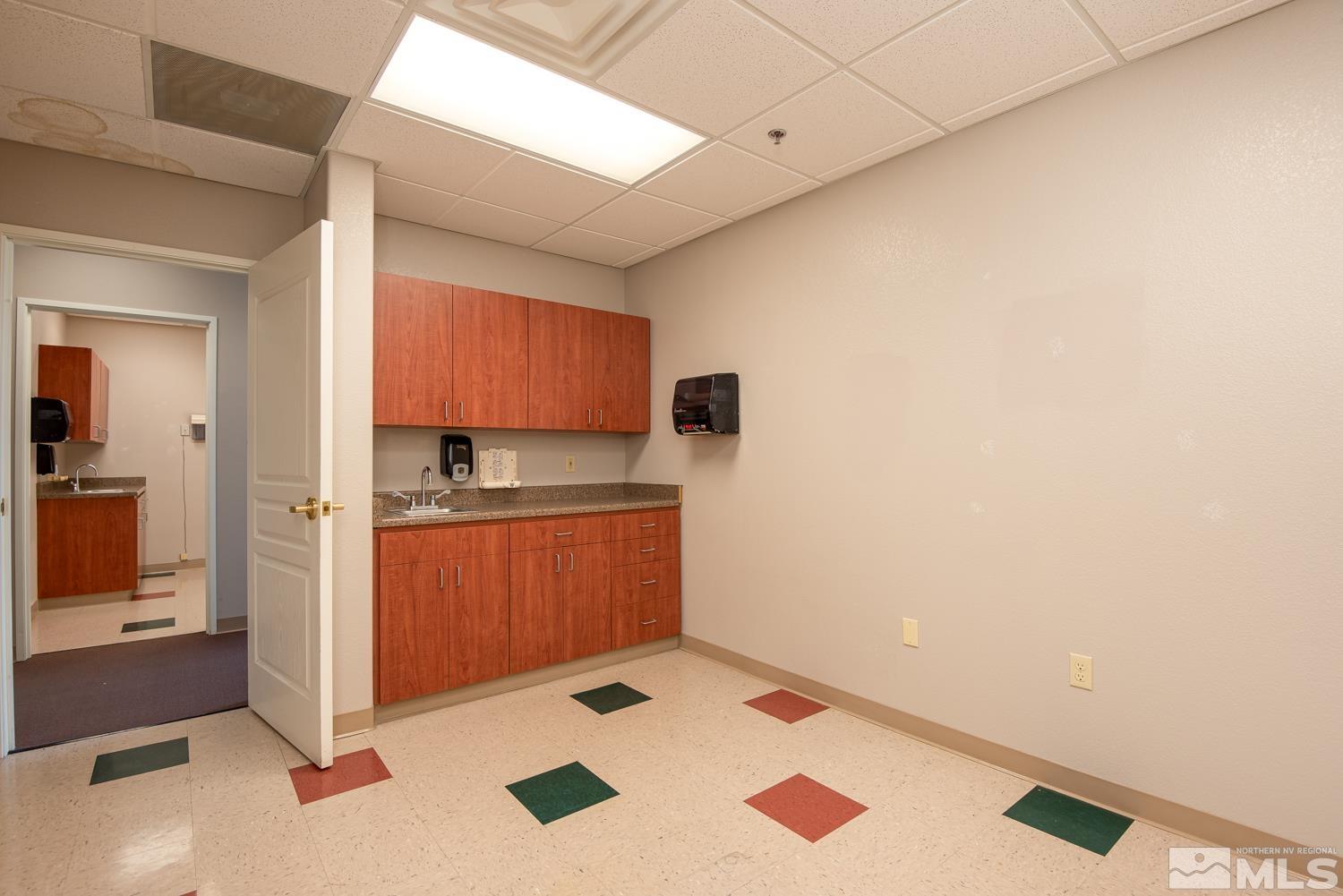 5 Pine Cone Road, Unit 102 Dayton, NV 89403 - Photo 15 of 21 a kitchen with a refrigerator and a stove