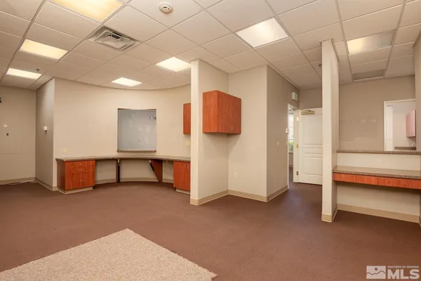 a view of an empty room with a fireplace