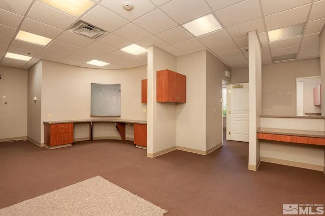 a view of an empty room with a fireplace