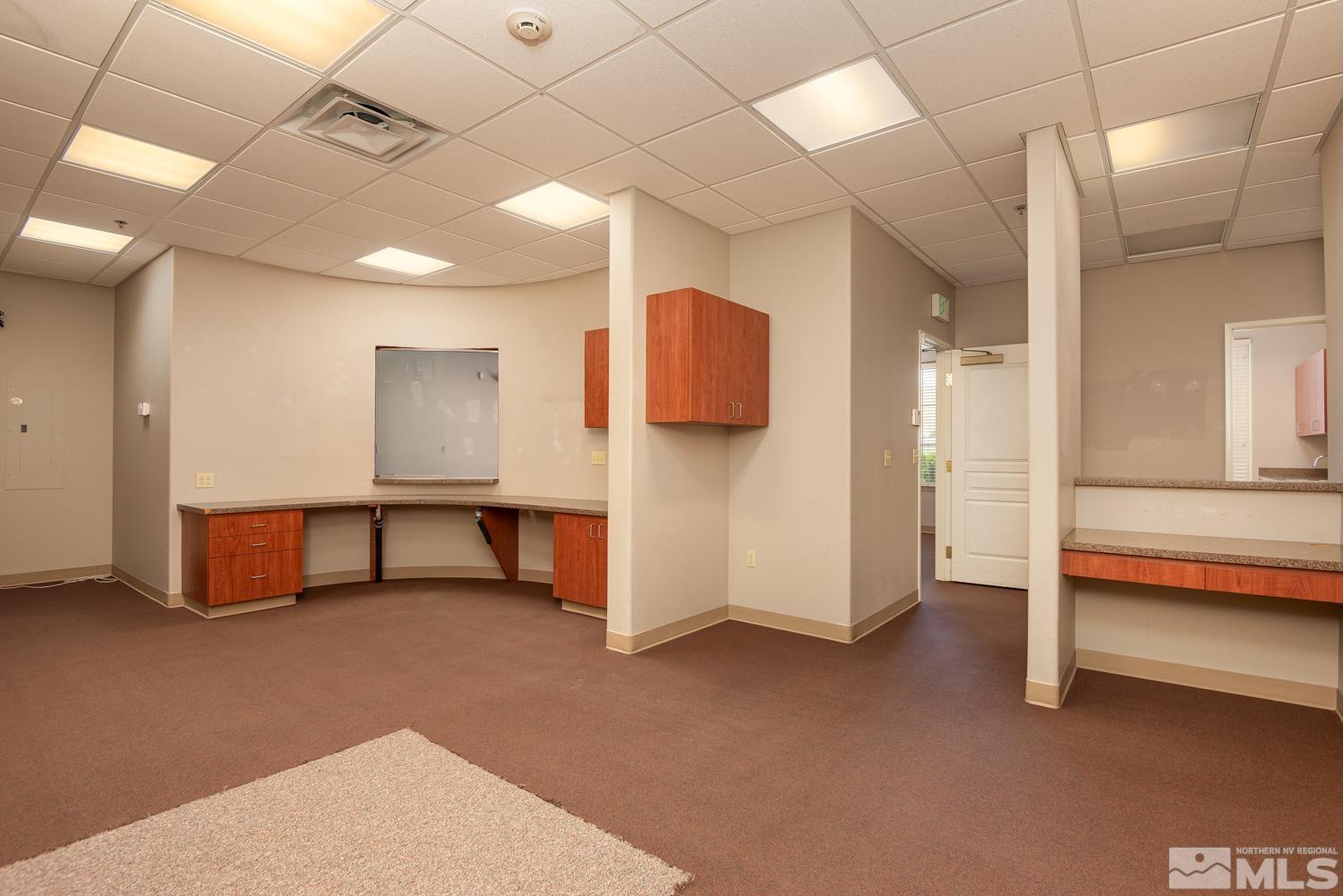 5 Pine Cone Road, Unit 102 Dayton, NV 89403 - Photo 8 of 21 a view of an empty room with a fireplace