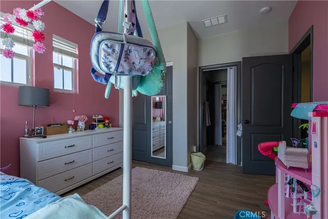 a room with furniture and wooden floor