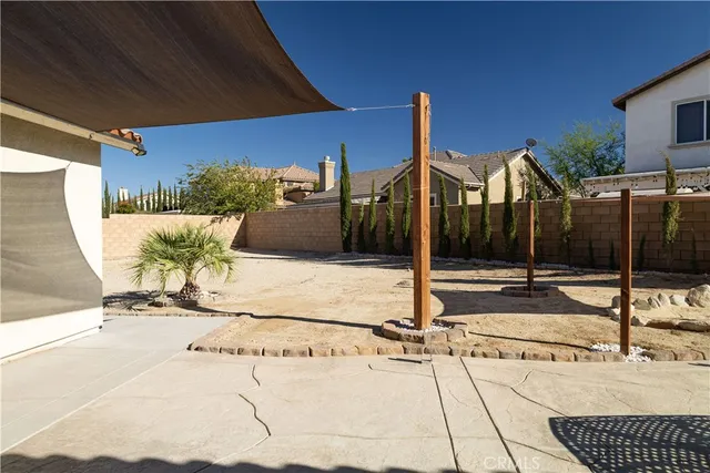 a view of a patio with a table and chairs