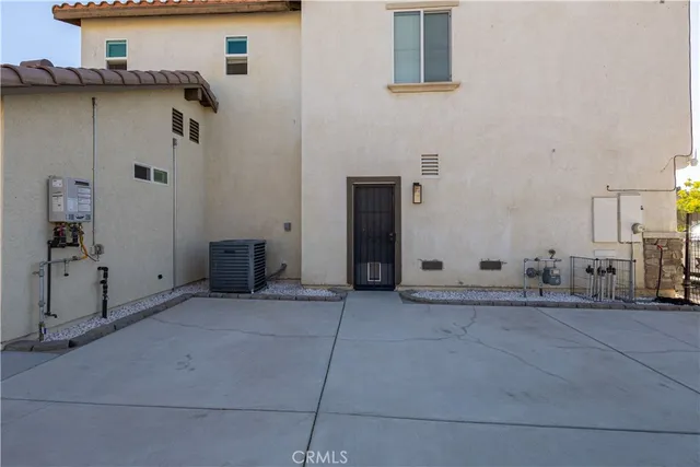 a view of a livingroom with wooden floor and a fireplace