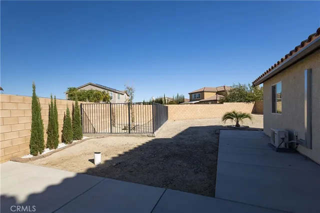 a view of a house with backyard floor and a window
