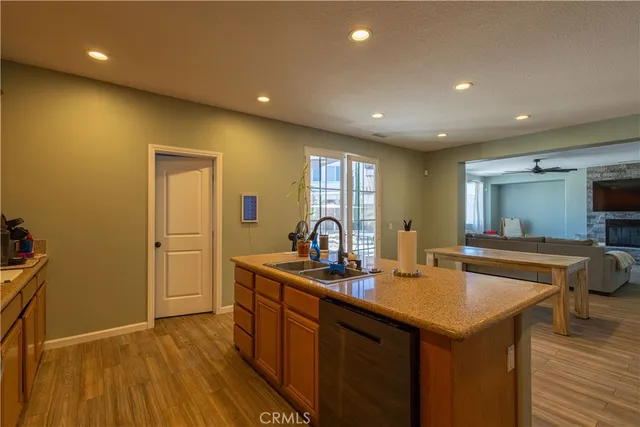 a kitchen with sink and refrigerator