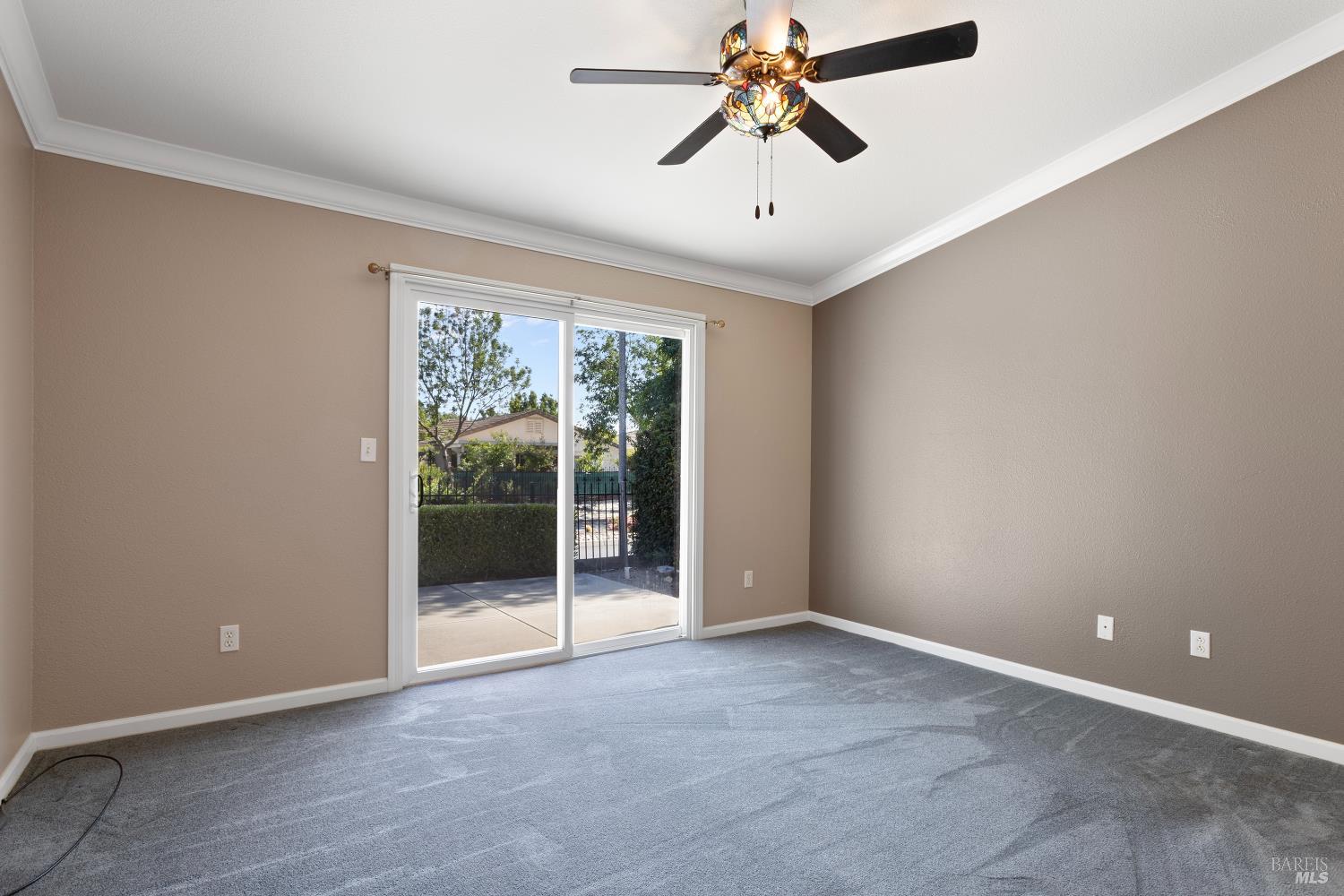 270 Foxwood Lane Rio Vista, CA 94571 - Photo 18 of 31 an empty room with chandelier fan and windows