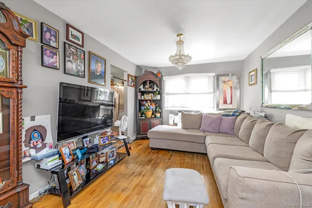 a living room with fireplace furniture and a flat screen tv