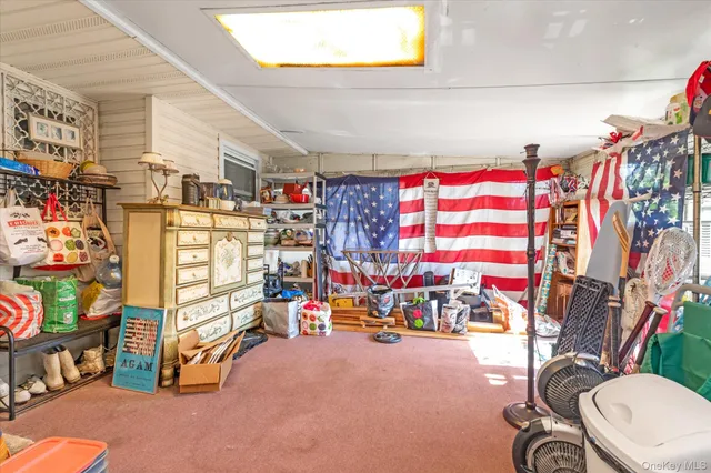 a bed room with a bed and a television