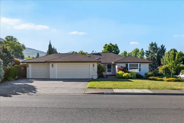 front view of a house with a yard
