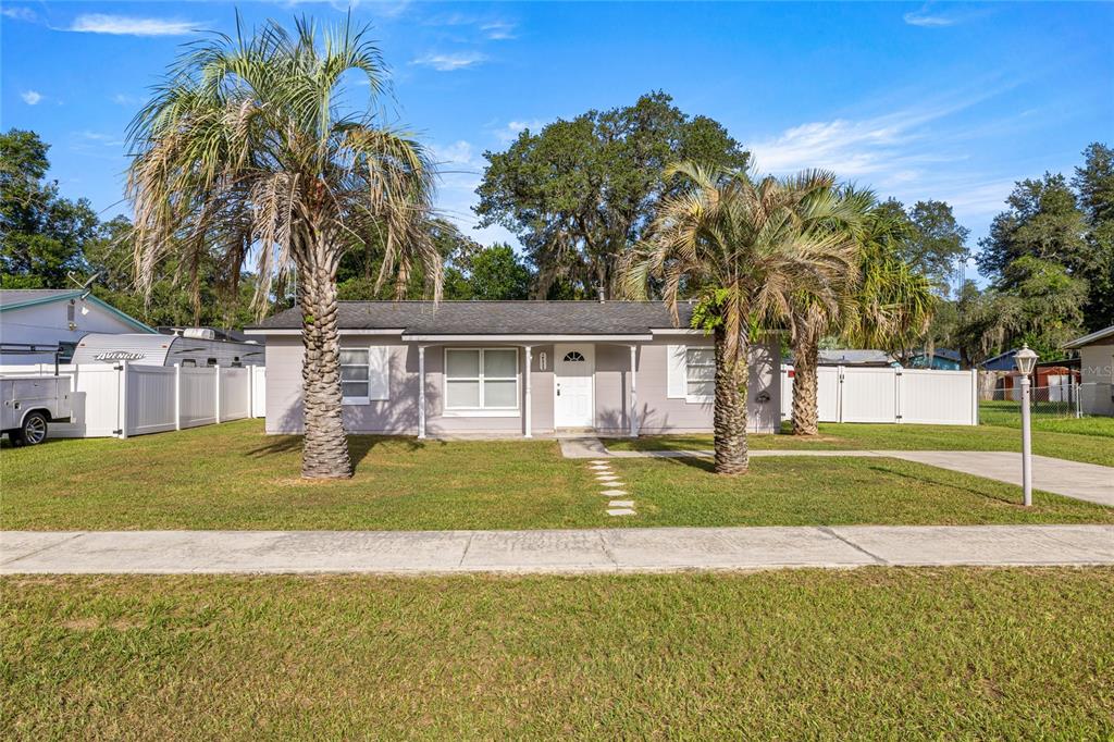 14532 Southwest 41st Terrace Ocala, FL 34473 - Photo 1 of 1 a view of a house with swimming pool and a yard